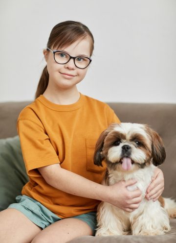 Girl With Down Syndrome Posing With Dog